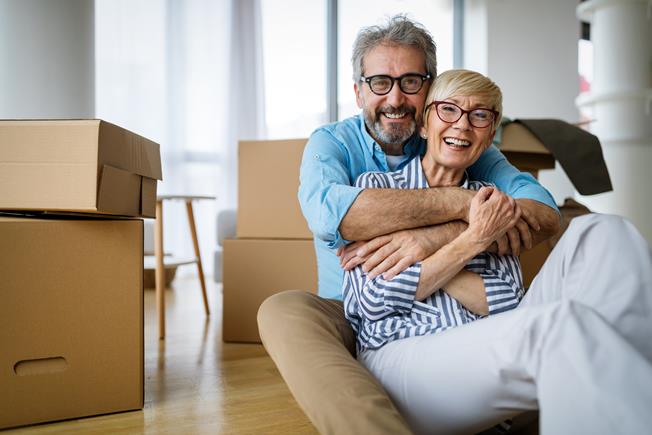 Happy senior couple downsizing their home in Maryland